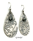 Sterling Silver Etched Teardrop shaped earrings with hematite stone