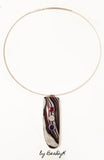 Pendant with Corvette Fordite cabochon set in sterling silver and set with red, white and blue cubic zirconias by BeaDyK.