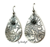 Sterling Silver Etched Teardrop shaped earrings with hematite stone