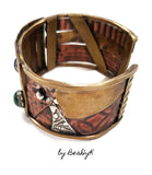 Mixed media cuff bracelet with malachite, lapis and turquoise stones set atop textured and antiqued copper, sterling and brass